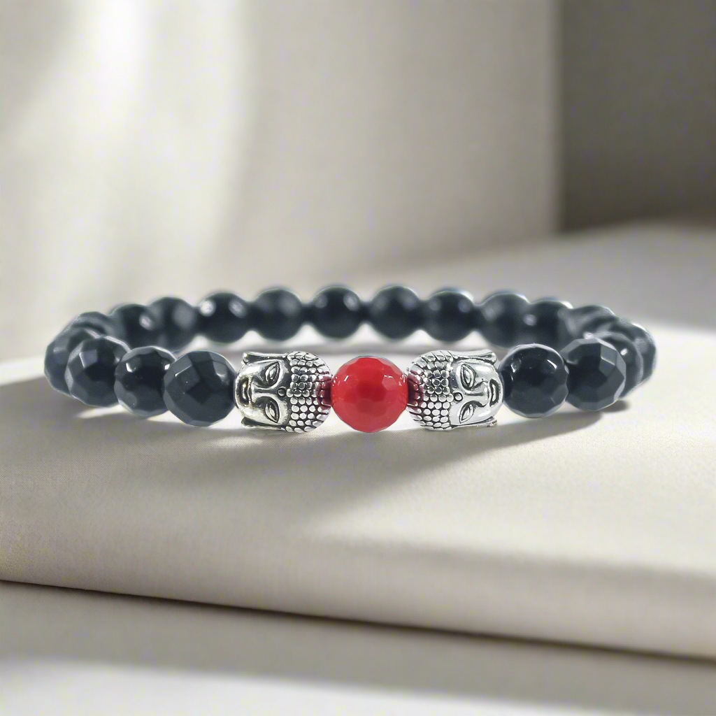 Handcrafted Budï black agate and red jade Buddha bracelet on wrist
